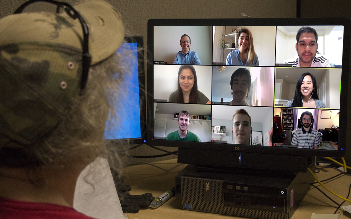 Photo illustration showing Zoom meeting on a video monitor