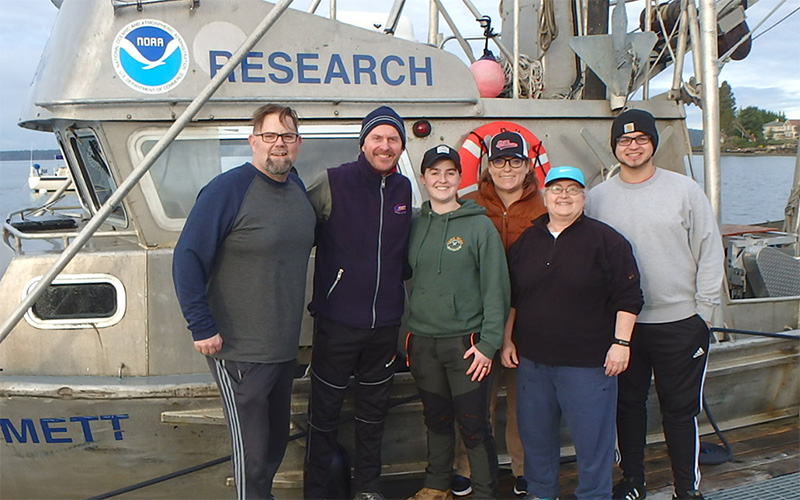 Algal bloom research team standing in front of NOAA research vessel Robert L. Emmett.