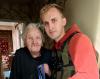 David Pavenko delivering food to older woman in Bakhmut, Ukraine.