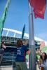 Madilyn Pawlowski helps raise the OL Reign flag on Lumenfield