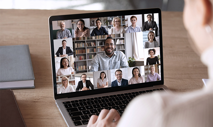 laptop with Zoom video faces