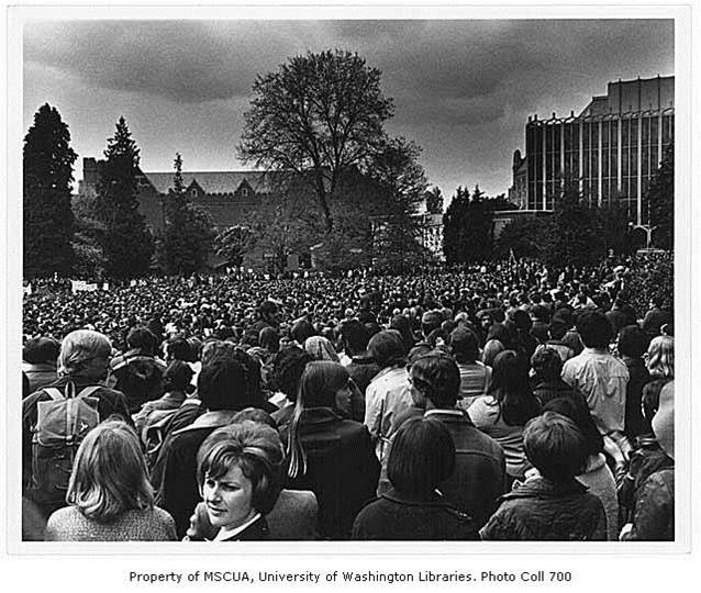 Black and white image of large crowd on campus