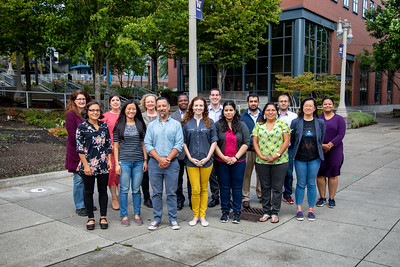 New faculty standing together on the UWT campus walkway