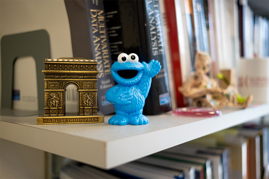 The Cookie Monster in Dr. Altaf Merchant's UW Tacoma office is a reference to his research on how far an iconic, nostalgic symbol can be modified before it loses its meaning -- imagine a green Cookie Monster.