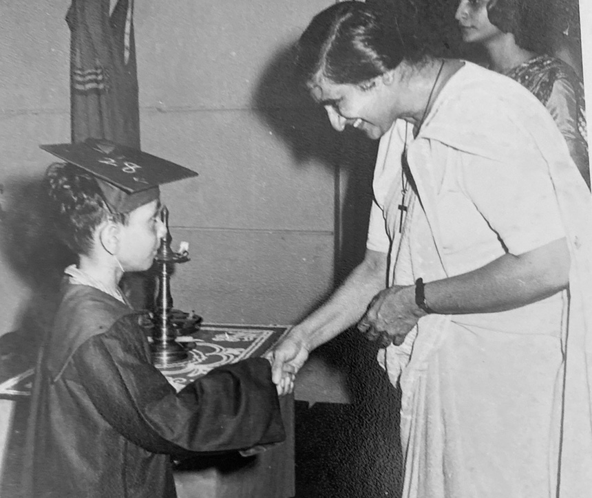 Altaf Merchant as a five-year-old boy graduating from kindergarten shaking the hand of his school's principal.
