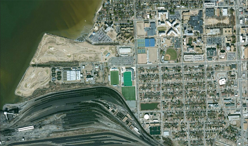 A current satellite image shows the Old Dominion University campus, upper right, near the Elizabeth River estuary, and close to one of the world's largest coal export docks.