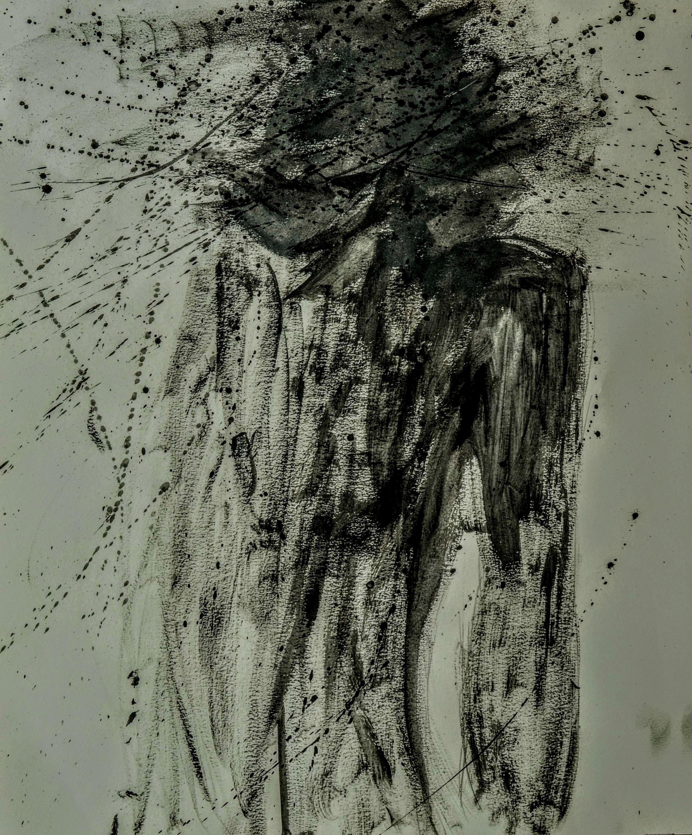 A series of abstract ink splatters and strokes that resemble a humanoid figure.