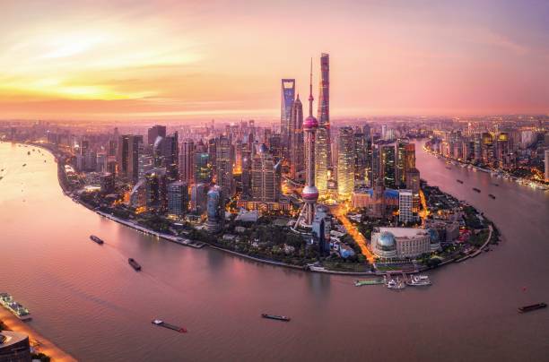 Shanghai at sunset with the skyline, river and boats