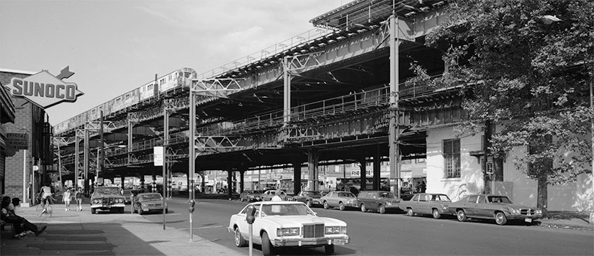 1984 black and white view of elevated rapid transit station in Williamsbridge, New York City. 