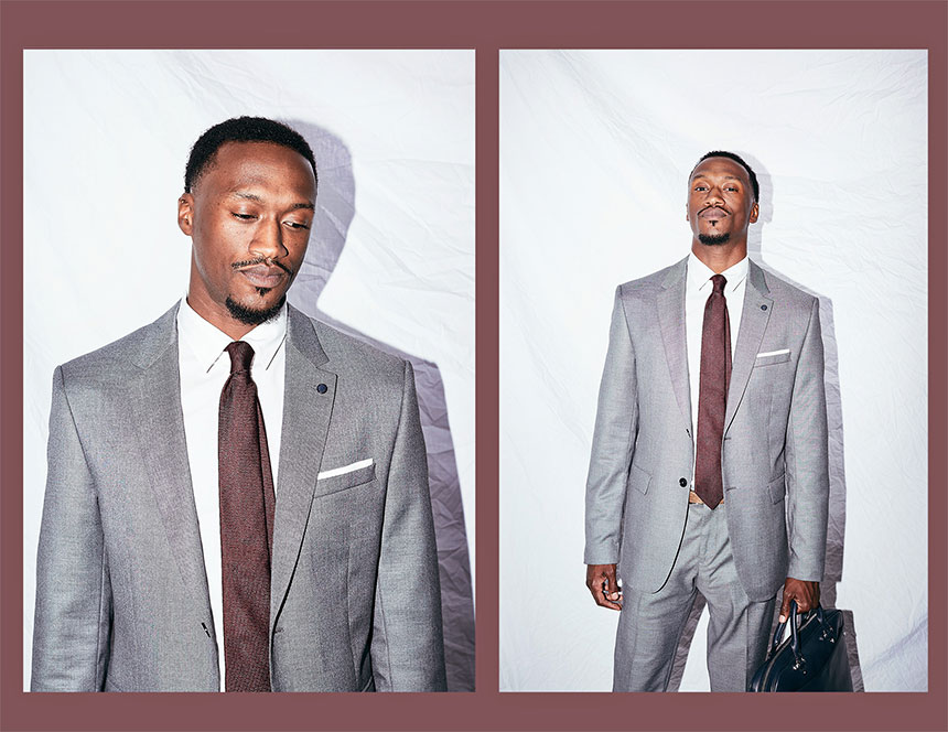 Byron Ragland, wearing business suit and carrying a briefcase