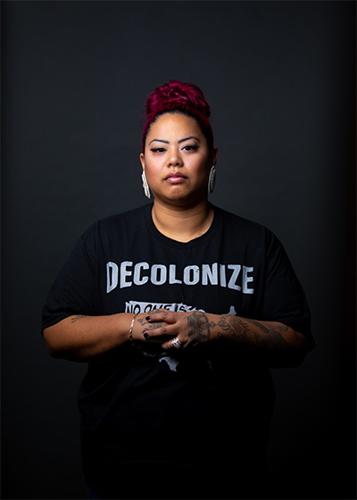 DeAnn Dillon, Ed.D. student, School of Education, wearing t-shirt that reads "Decolonize"