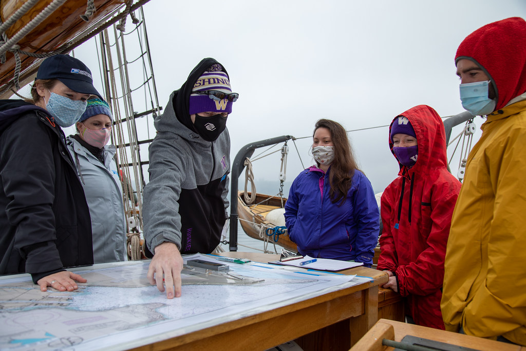 Students viewing a marine chart aboard SS Adventuress