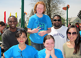Students from UW Tacoma and McCarver Elementary School pose at McCarver Park