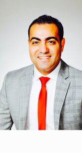 Man in grey blazer and red tie