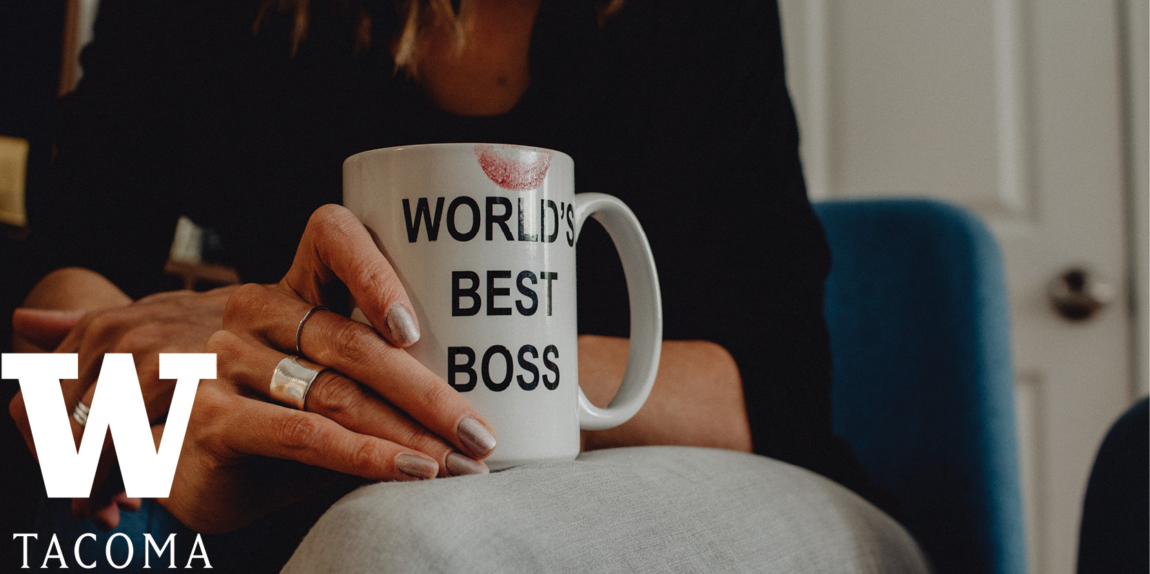 woman holding coffee cup with words world's best boss