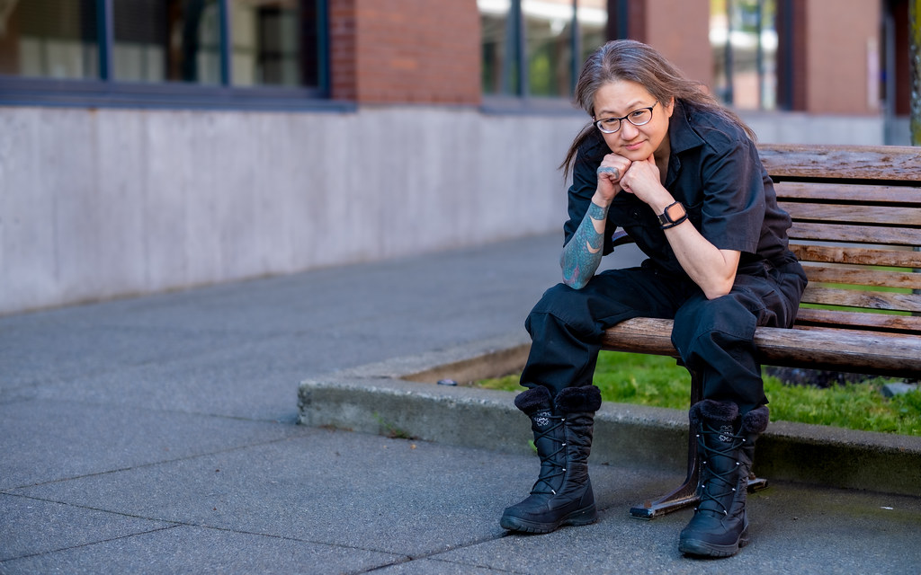 Rain Wilson, UW Tacoma math student, sitting on campus bench
