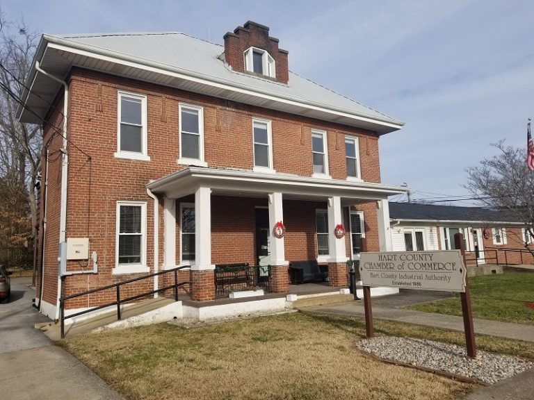 Former Hart County Jail in Munfordville, Kentucky. Two-story brick structure with front portico and hip roof.