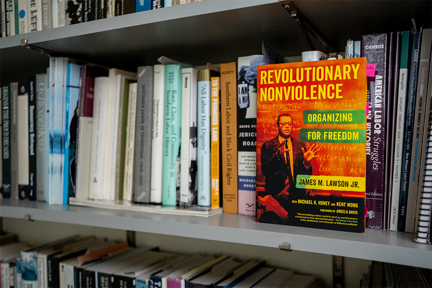 Mike Honey's book "Revolutionary Nonviolence" on a shelf with other Honey books.
