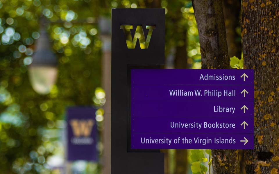 Directional sign on UW Tacoma campus with arrow pointing to "University of the Virgin Islands"
