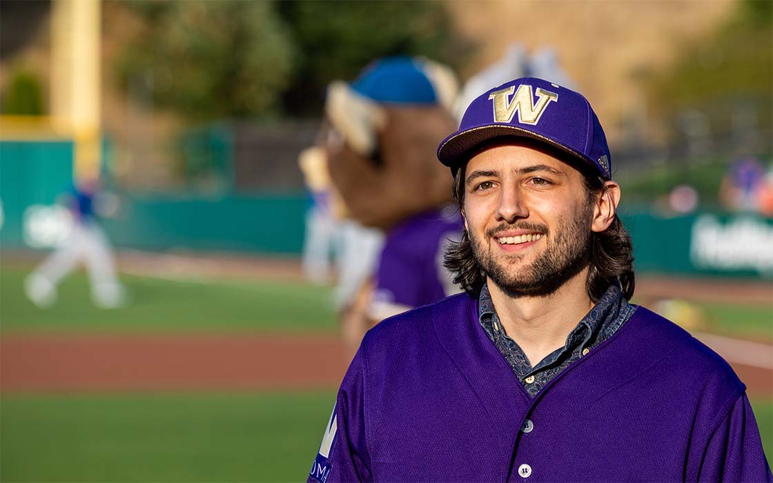 Eric Barone, '11, B.S. Computer Science & Systems, at Cheney Stadium during Paint the Park Purple event
