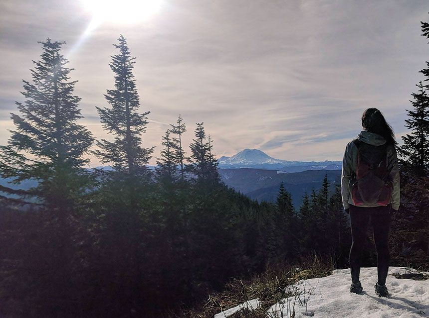 Dr. Ellen Bayer, UW Tacoma assistant professor, gazes at Mt. Rainier. Photo by Seth Wolpin.