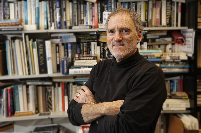 Portrait of Dr. Michael Honey in his book-lined office at UW Tacoma.