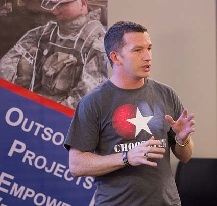 Steve Buchanan, '13, '14, giving a presentation about his start-up, ChooseVets.