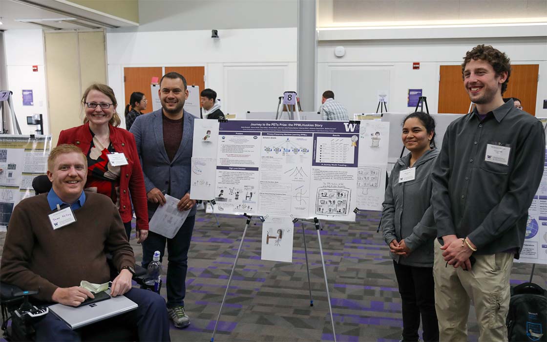 PPMLHuskies team with poster at UW Tacoma School of Engineering & Technology 2023 Spring Research Showcase