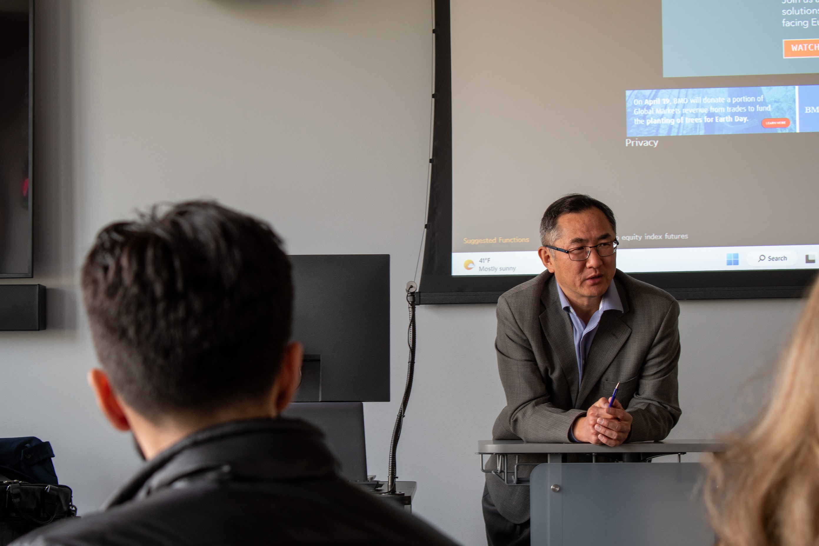 Fei Leng teaches a class inside the Financial Wellness Lab