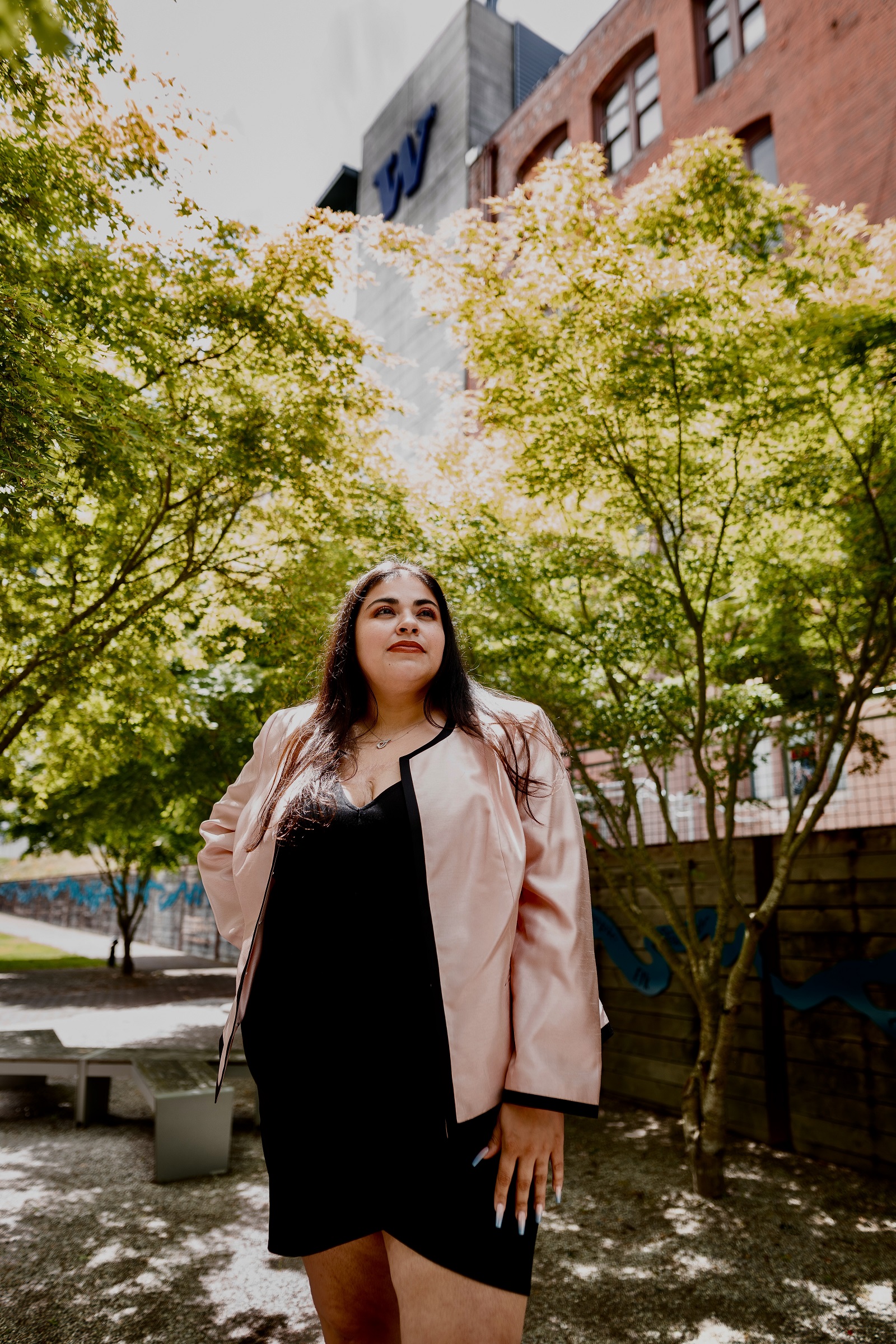 Fanny Castro poses in front of Tioga Building on UWT Campus