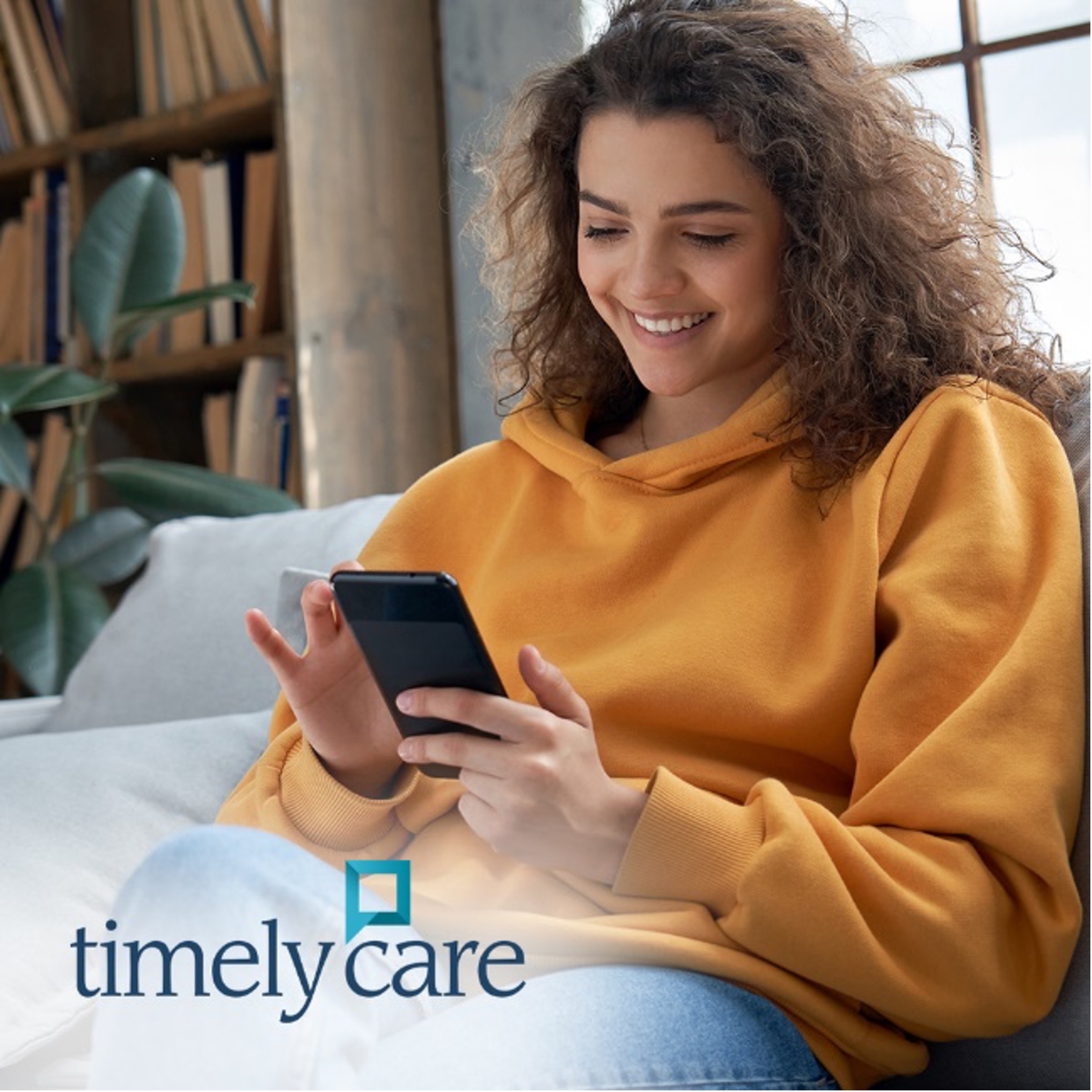 Photo of woman holding phone with TimelyCare logo.