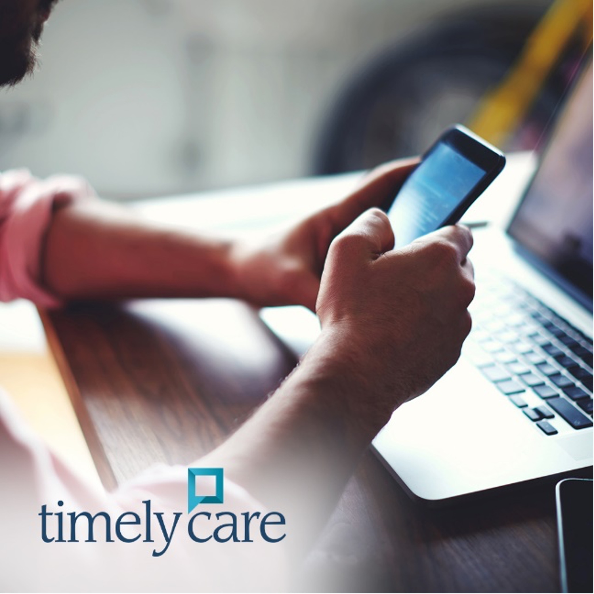 Photo of person holding phone with laptop in background. The words "timelycare" are written on top of photo.