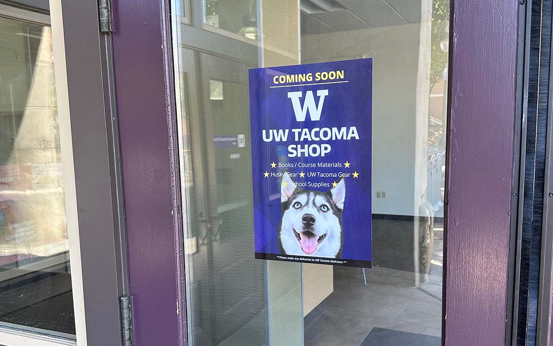 Sign on door of UW Tacoma building GWP reads "Coming Soon - UW Tacoma Shop"