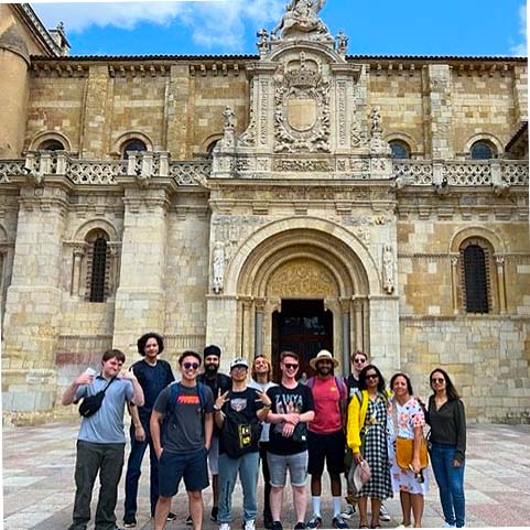 UW Tacoma students standing in front of historic structure in León, Spain.