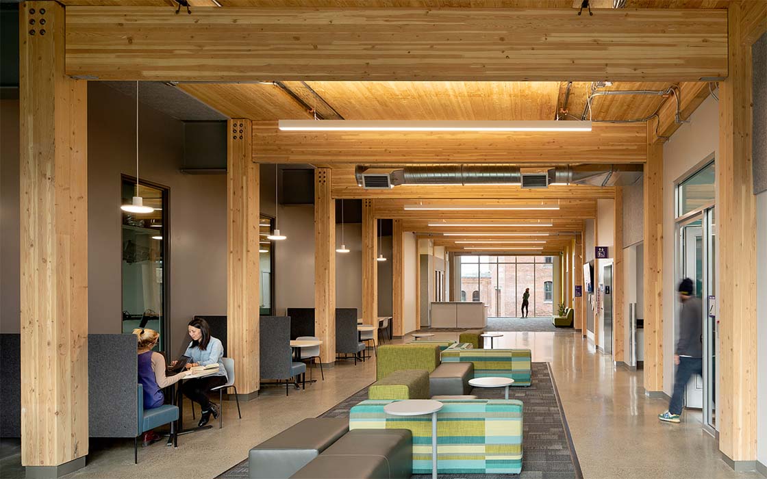 View of "connector" space in UW Tacoma's Milgard Hall, showing mass timber structural elements