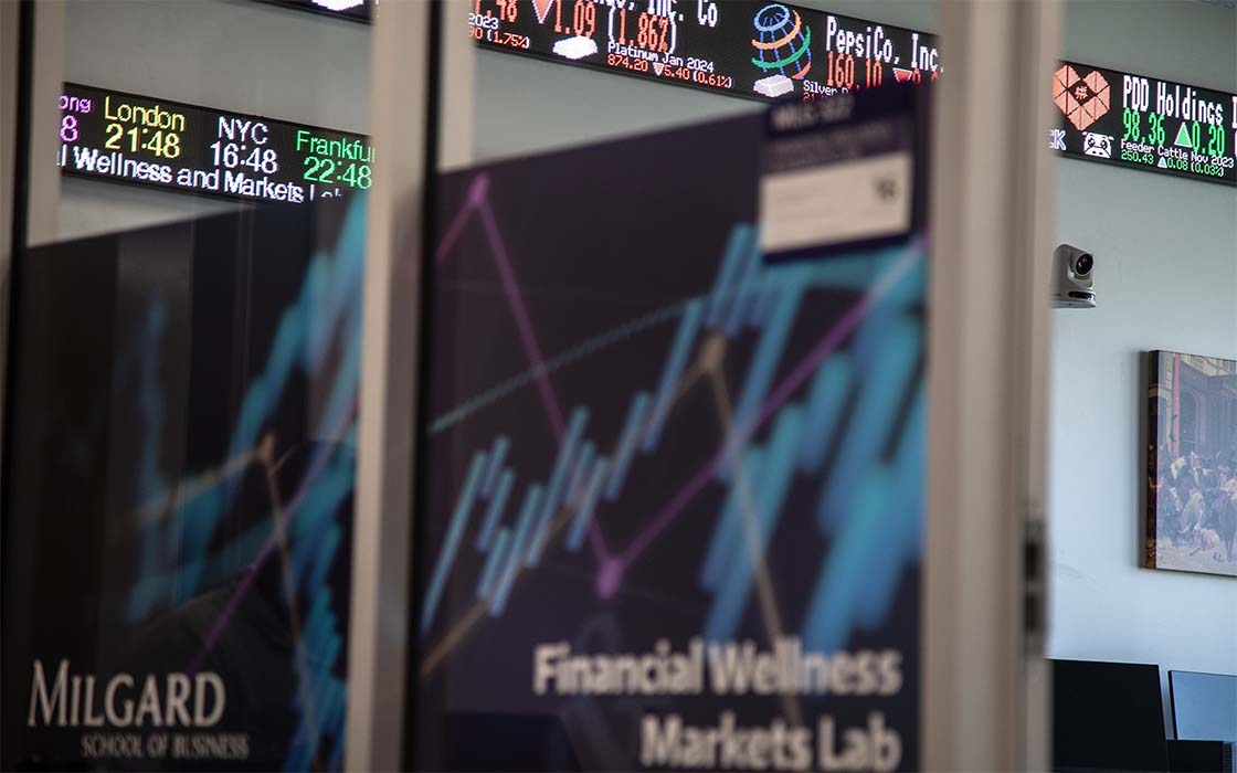 Financial Wellness Markets Lab at UW Tacoma showing stock tickers and window decals