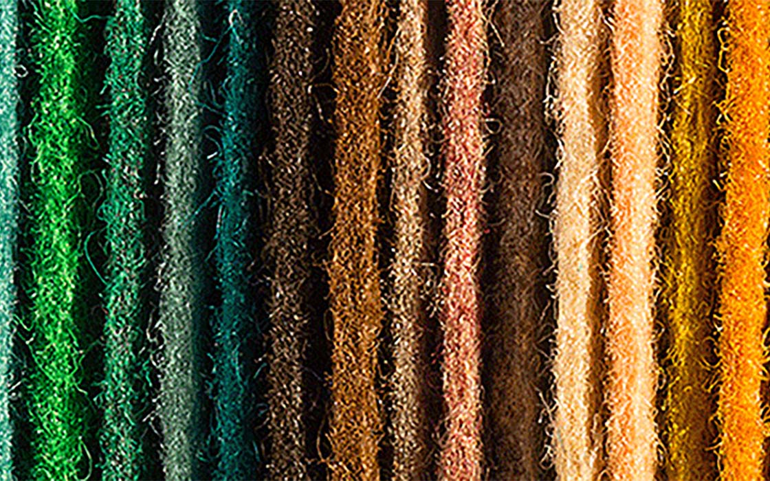 A series of dyed yarns in a rainbow of colors