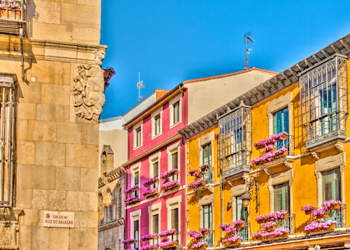 Image of colorful homes along a street in León, Spain