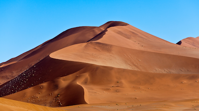 Namibia landscape featuring reddish brown sand dune