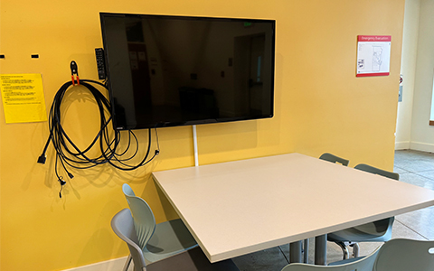 Large TV, laptop cables and table for five people available in Walsh Garder third floor atrium