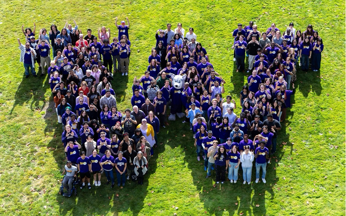 UW Tacoma students, faculty and staff gather for the campus’s 2025 “W Photo” on the Court 17 Green.