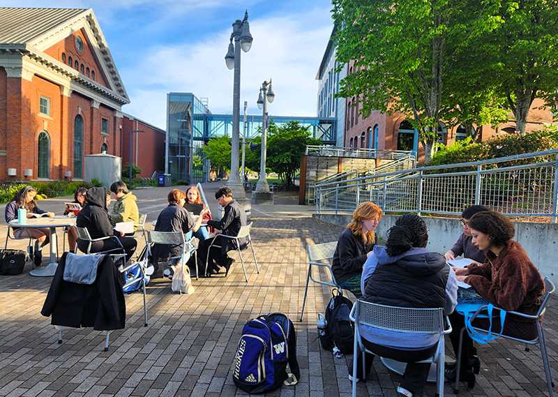 A photo of students working outside at UW Tacoma