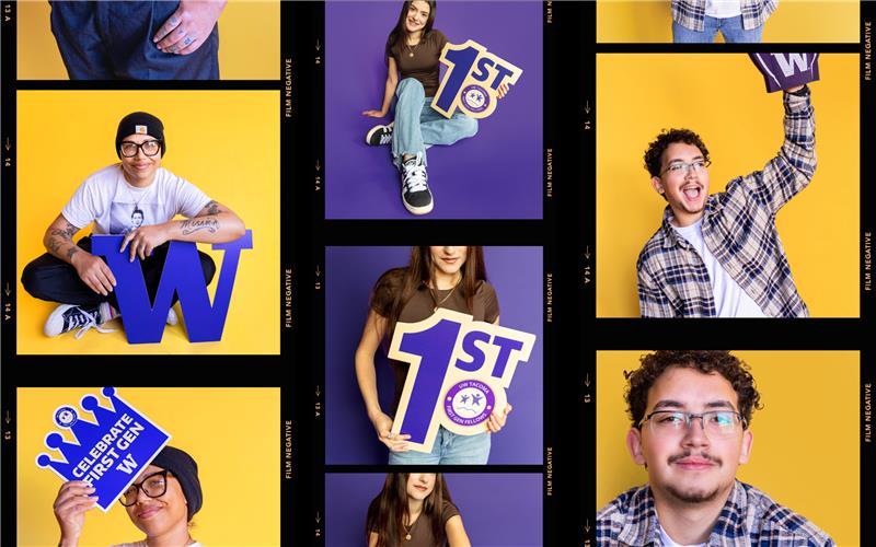 A student holding a "1st" cut-out sign in front of a purple backdrop.