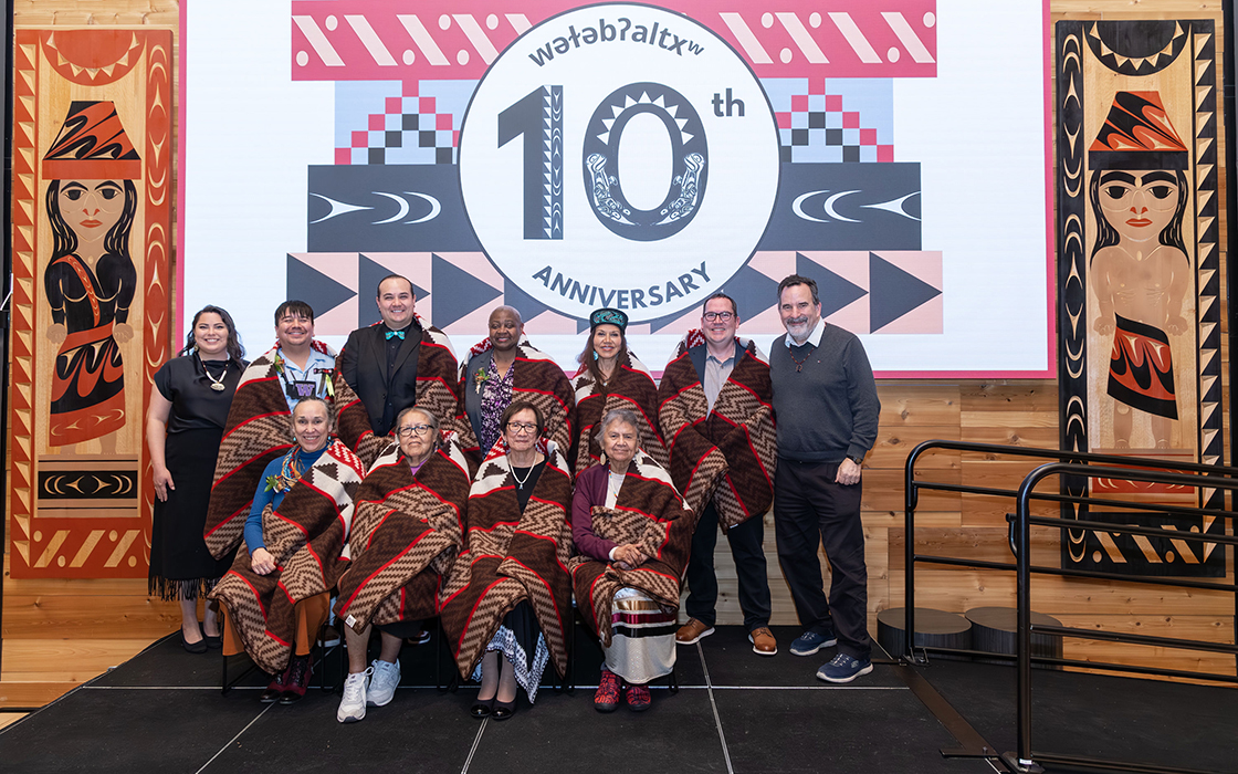 A group photo captured at the 10th anniversary celebration of wǝɫǝbʔaltxʷ - Intellectual House.