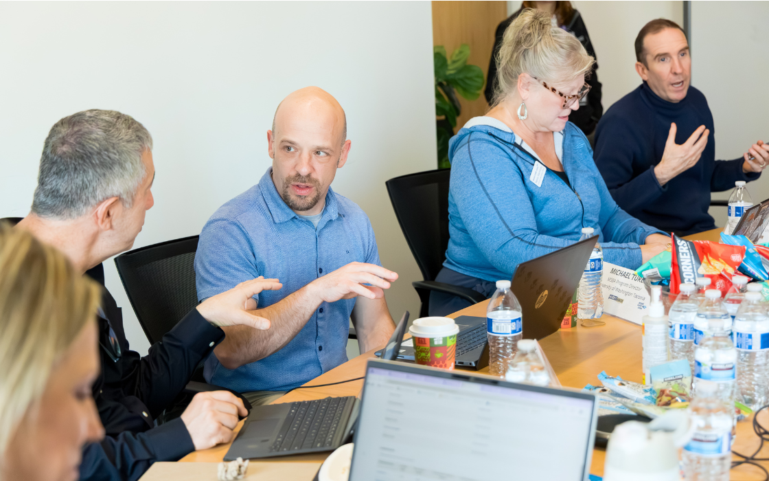 The HuskyHack judges deliberate.