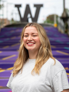 Headshot of Brandy Featherstone in front of the UW Tacoma staircase