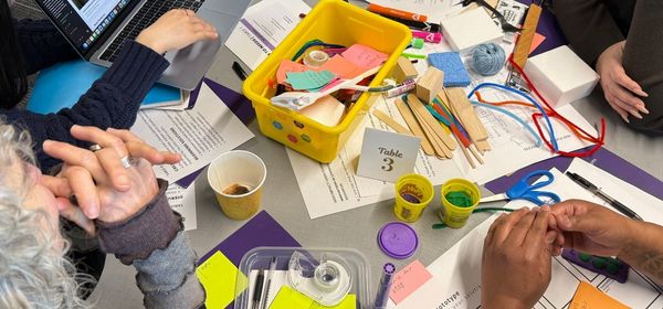Participants explore contents of workshop bins