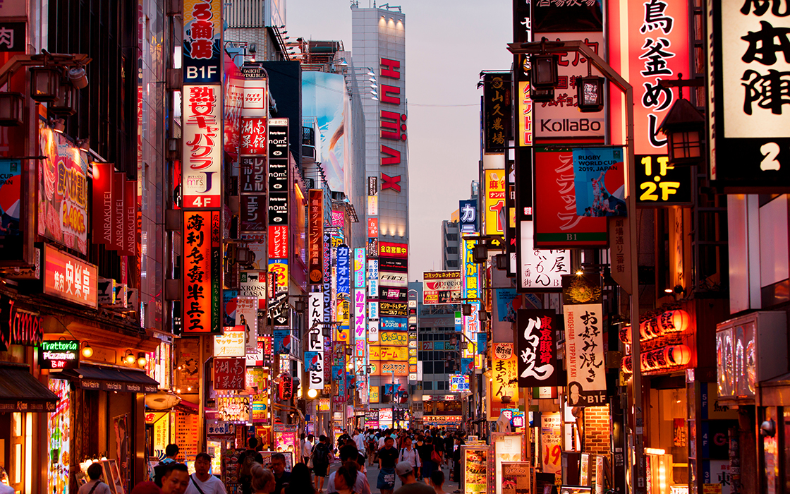 A photo of downtown Tokyo at night.