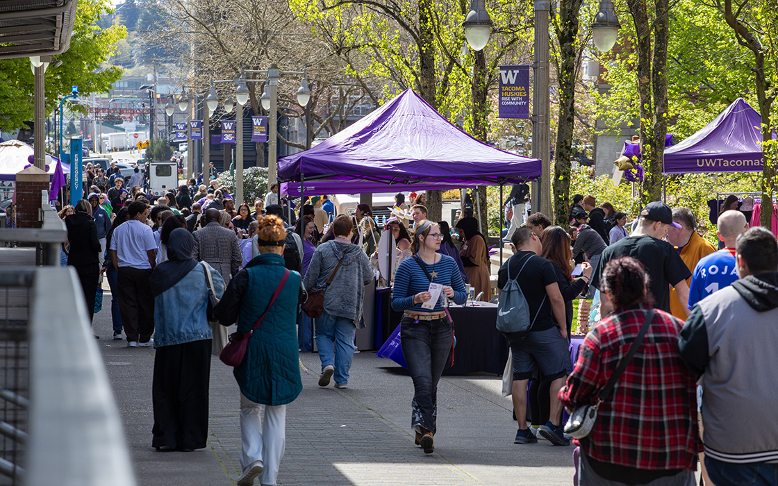 A crowd of people exploring UW Tacoma's campus during Husky Fest 2026.