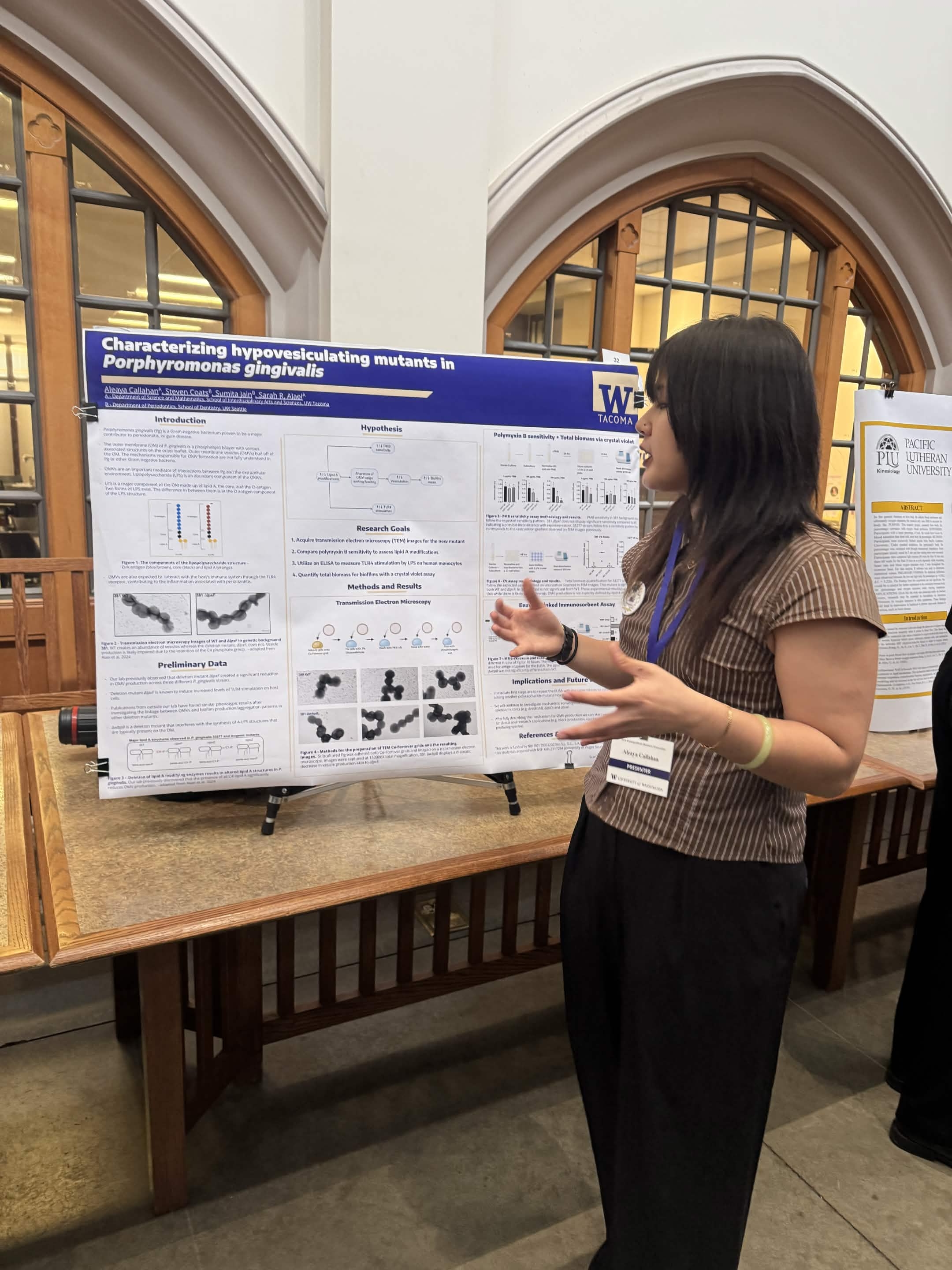 Aleaya Callahan presenting a poster at the 2026 Undergraduate Research Symposium.